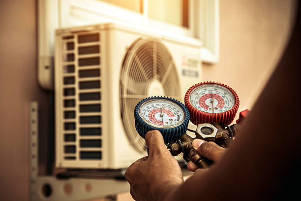 Professional Air Conditioning Service technician working in Atchison, KS